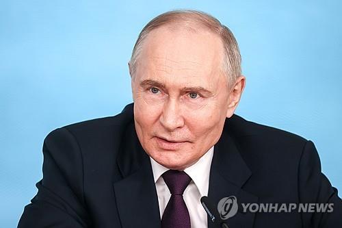 This photo provided by TASS shows Russian President Vladimir Putin during a meeting with top executives of the world's leading foreign media groups on the sidelines of the 2024 St Petersburg International Economic Forum at the Lakhta Centre on June 5. (Yonhap)