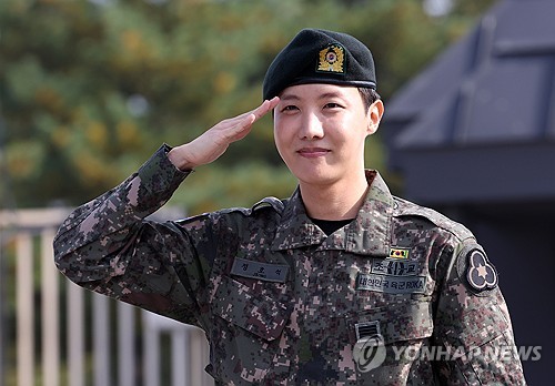 BTS member J-Hope salutes outside the main gate of the 36th Army Infantry Division in Wonju, some 90 kilometers southeast of Seoul, on Oct. 17, 2024, after completing his mandatory military service. (Yonhap)