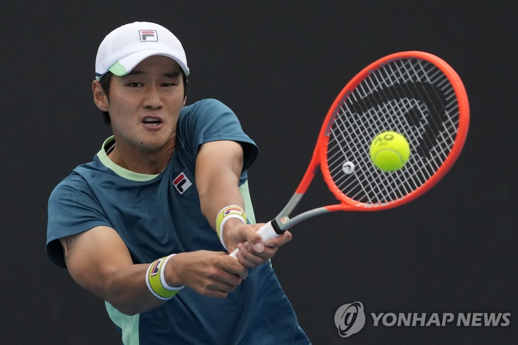 In this Associated Press photo, Kwon Soon-woo of South Korea hits a backhand return to Holger Rune of Denmark during their first round men's singles match at the Australian Open in Melbourne on Jan. 17, 2022. (Yonhap)