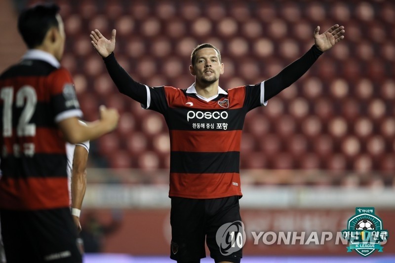 This Sept. 27, 2020, file photo provided by the Korea Professional Football League shows Stanislav Iljutcenko (R) of Pohang Steelers celebrating a goal during a K League 1 match against Gwangju FC at Pohang Steel Yard in Pohang, 370 kilometers southeast of Seoul. (PHOTO NOT FOR SALE) (Yonhap)