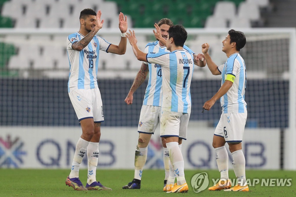 In this AFP photo, Ulsan Hyundai FC players celebrate their 2-1 win over Perth Glory during their Group F match at the Asian Football Confederation Champions League at Education City Stadium in Al Rayyan, Qatar, on Nov. 24, 2020. (Yonhap)