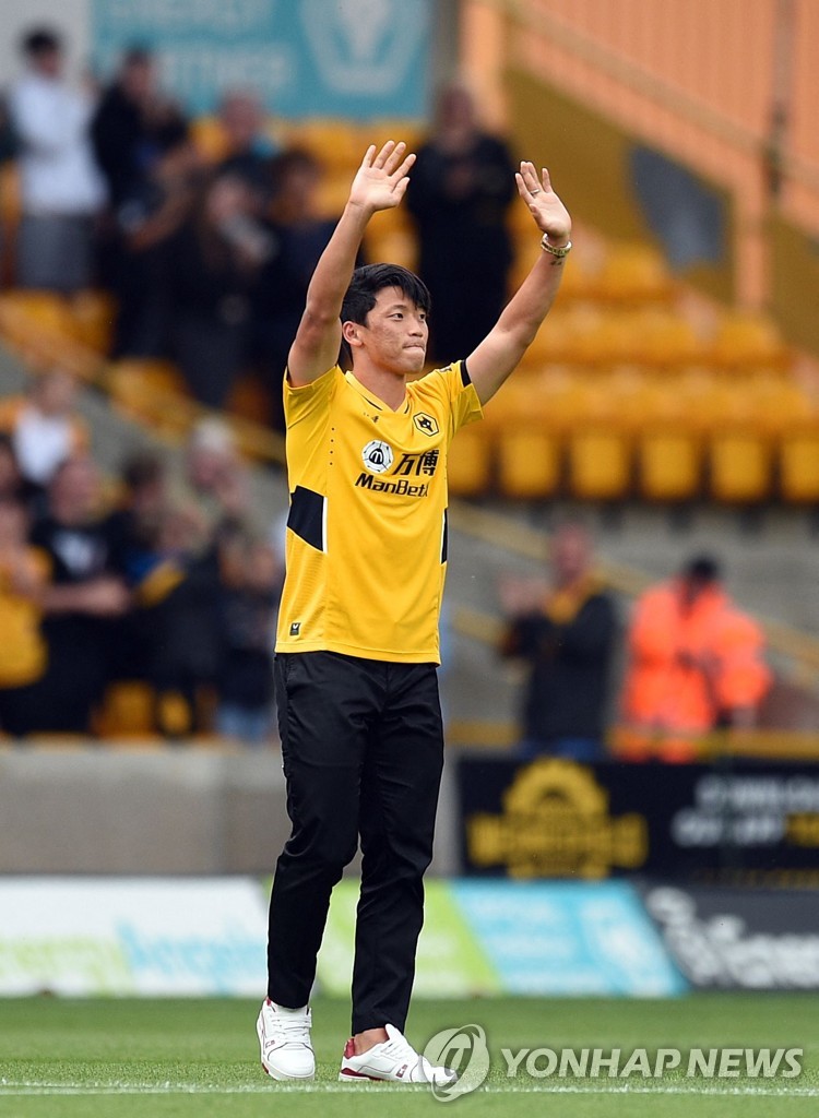 In this AFP photo, South Korean forward Hwang Hee-chan, the latest signing by Wolverhampton Wanderers, waves to the crowd ahead of the club's Premier League match against Manchester United at Molineux Stadium in Wolverhampton in England on Aug. 29, 2021. (Yonhap)