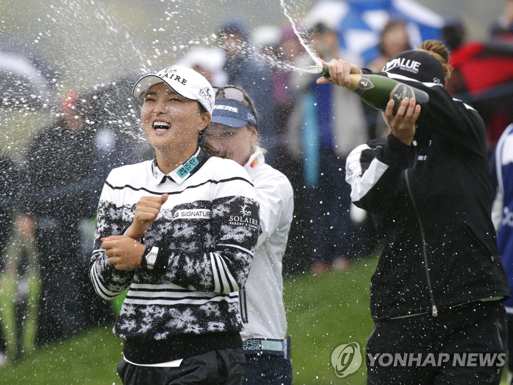 In this UPI photo, Ko Jin-young of South Korea (L) gets sprayed with champagne by fellow players Brooke Henderson of Canada (C) and Gaby Lopez of Mexico after winning the Cognizant Founders Cup at Mountain Ridge Country Club in West Caldwell, New Jersey, on Oct. 10, 2021. (Yonhap)