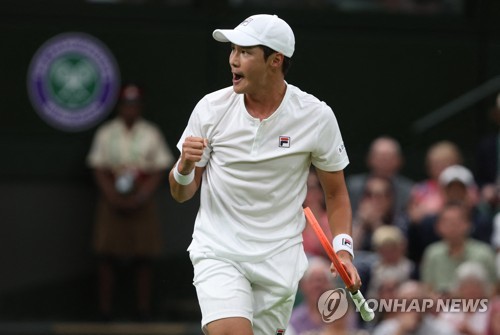 In this Reuters photo, Kwon Soon-woo of South Korea celebrates a point against Novak Djokovic of Serbia during their men's singles first round match at Wimbledon at All England Club in London on June 27, 2022. (Yonhap)