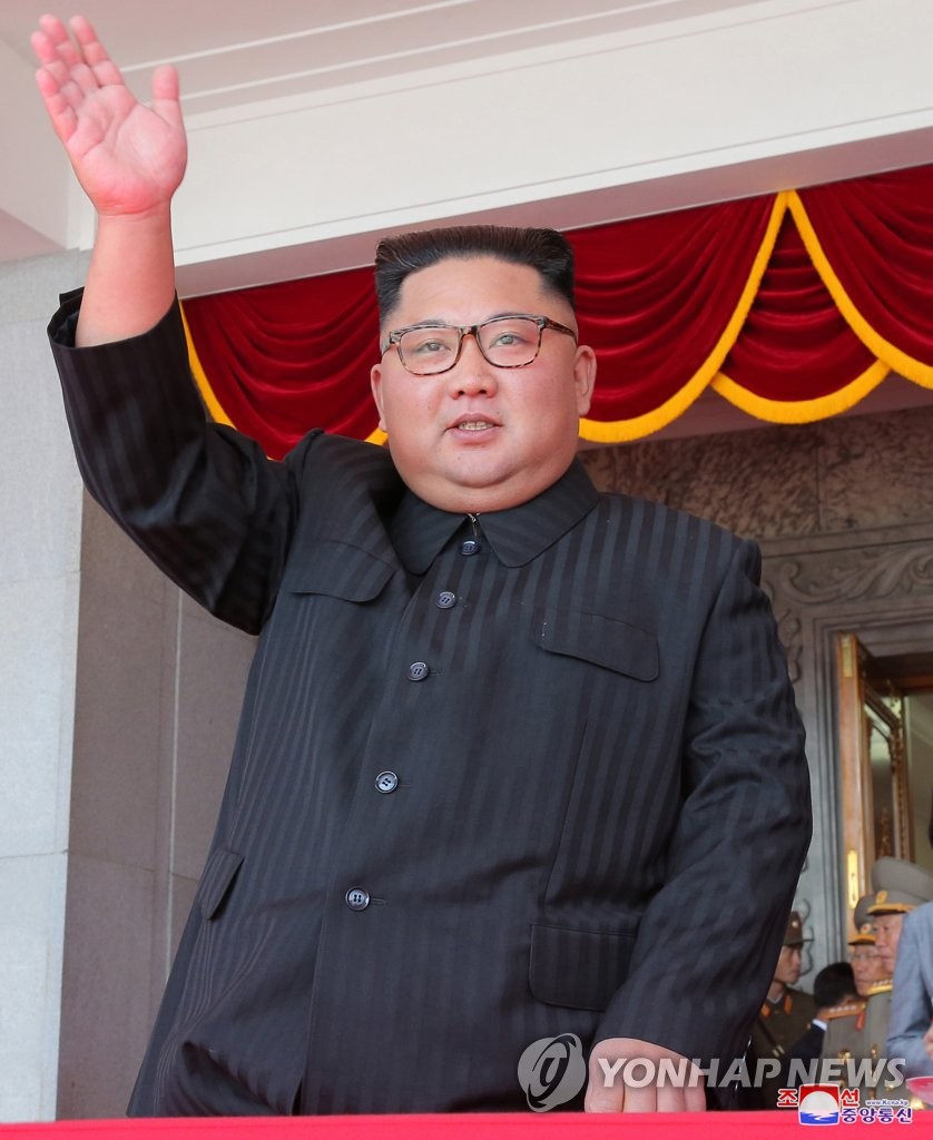 In this file photo released by the North's official Korean Central News Agency, North Korean leader Kim Jong-un waves during a military parade at Kim Il Sung Square in Pyongyang on Sept. 9, 2018, to mark the 70th anniversary of North Korea's founding day. (For Use Only in the Republic of Korea. No Redistribution) (Yonhap)