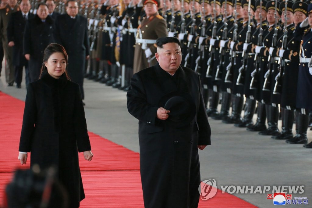 North Korea's leader Kim Jong-un (R) and his wife, Ri Sol-ju, leave for China in this photo from the North's Korean Central News Agency on Jan. 8, 2019. The report said Kim will visit China from Jan. 7-10 at the invitation of Chinese President Xi Jinping. (For Use Only in the Republic of Korea. No Redistribution) (Yonhap)