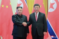 (LEAD) Xi to visit N. Korea amid trade tensions with U.S.