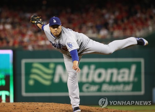 Los Angeles Dodgers starting pitcher Hyun-Jin Ryu throws to a Washington  Nationals batter during the first inning in Game 3 of a baseball National  League Division Series on Sunday, Oct. 6, 2019