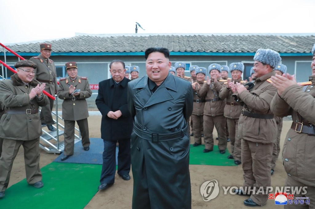 North Korean leader Kim Jong-un (C) is greeted by the North's officials and soldiers at the Academy of Defense Science on Nov. 28, 2019, as he oversees the test-firing of a "super-large multiple launch rocket system," in this photo released by the North's official Korean Central News Agency. South Korea's military said the North fired two projectiles from what is presumed to be a super-large multiple rocket launcher from Yeonpo in the country's eastern South Hamgyong Province toward the East Sea. (For Use Only in the Republic of Korea. No Redistribution) (Yonhap)