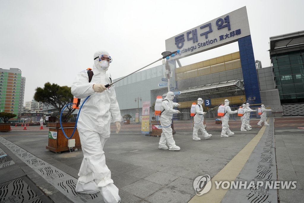Quarantine officials carry out a disinfection operation in Daegu, 300 kilometers south of Seoul, on Feb. 29, 2020, to fight the spread of the new coronavirus in the city. (Yonhap)