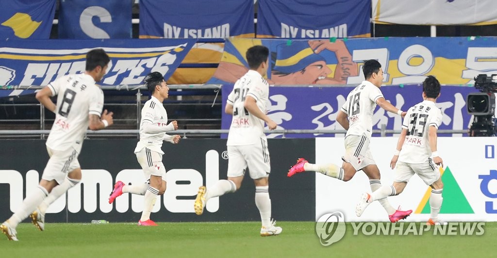 In this file photo, from May 24, 2020, Busan IPark players celebrate their goal against Ulsan Hyundai FC in their K League 1 match at Ulsan Munsu Football Stadium in Ulsan, 400 kilometers southeast of Seoul. (Yonhap)