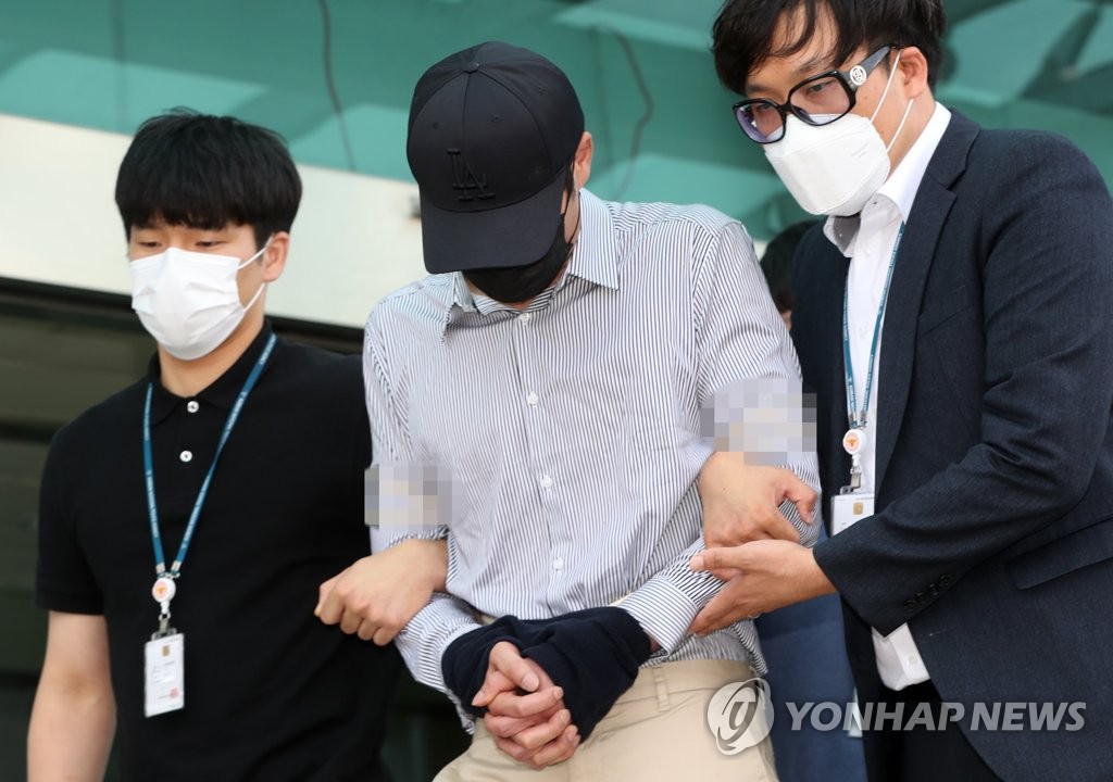 A 38-year-old key suspect in the high-profile Telegram sex abuse case, whose identity has not been made public, is transferred to the state prosecutors' office for further questioning from a detention center in Chuncheon, 85 kilometers east of Seoul, on July 3, 2020. (Yonhap)