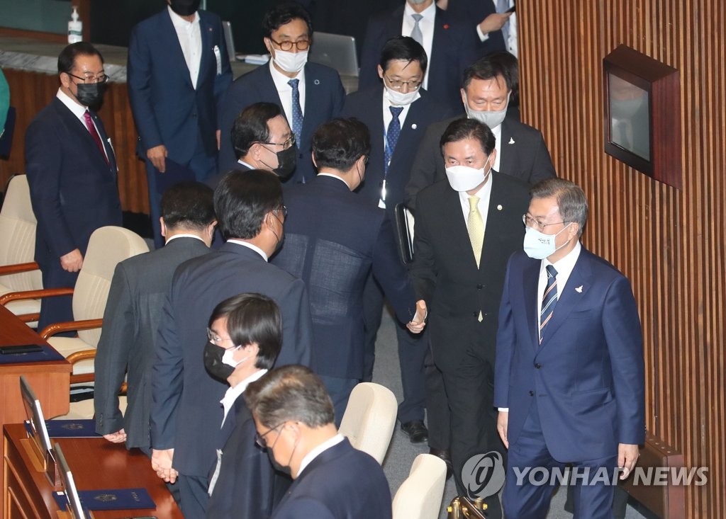 President Moon Jae-in (R) leaves the National Assembly hall after addressing the opening ceremony of the new parliament in Seoul on July 16, 2020. (Yonhap)