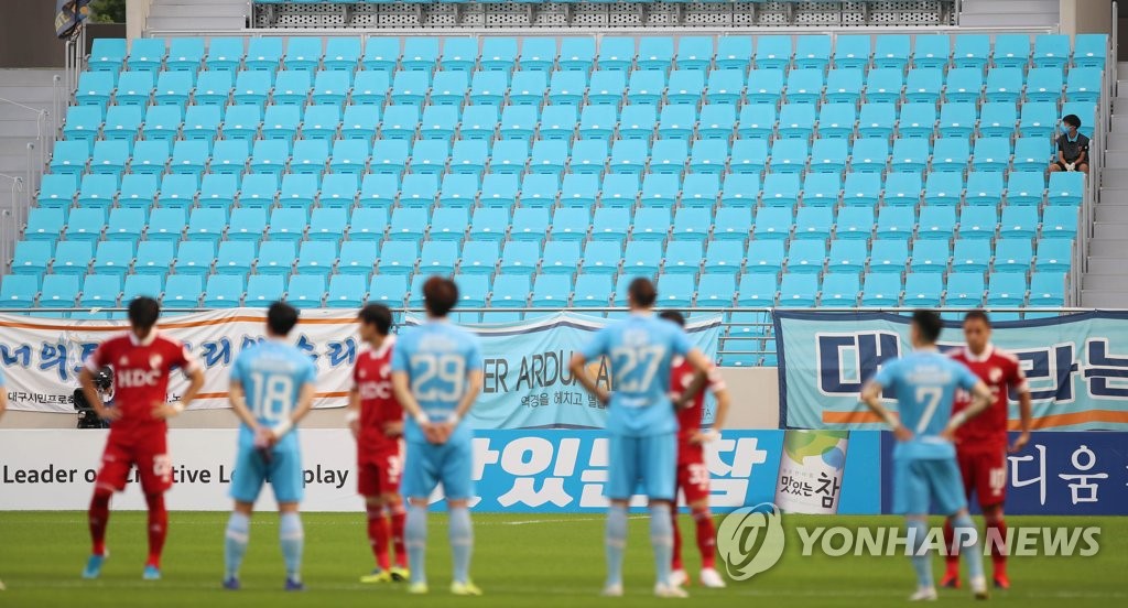 In this file photo from July 26, 2020, Daegu FC and Busan IPark play a K League 1 match in front of empty stands at DGB Daegu Bank Park in Daegu, 300 kilometers southeast of Seoul. (Yonhap)