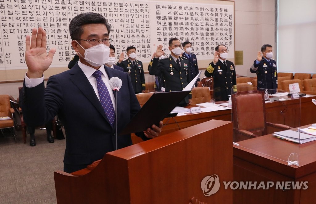 Defense Minister Suh Wook (L) takes an oath during a parliamentary audit session at the National Assembly in Seoul on Oct. 23, 2020. (Yonhap)