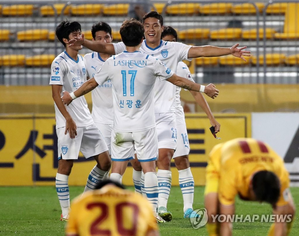 In this file photo from Oct. 3, 2021, Pohang Steelers players celebrate their 3-2 victory over Gwangju FC in their K League 1 match at Gwangju Football Stadium in Gwangju, about 330 kilometers south of Seoul. (Yonhap)