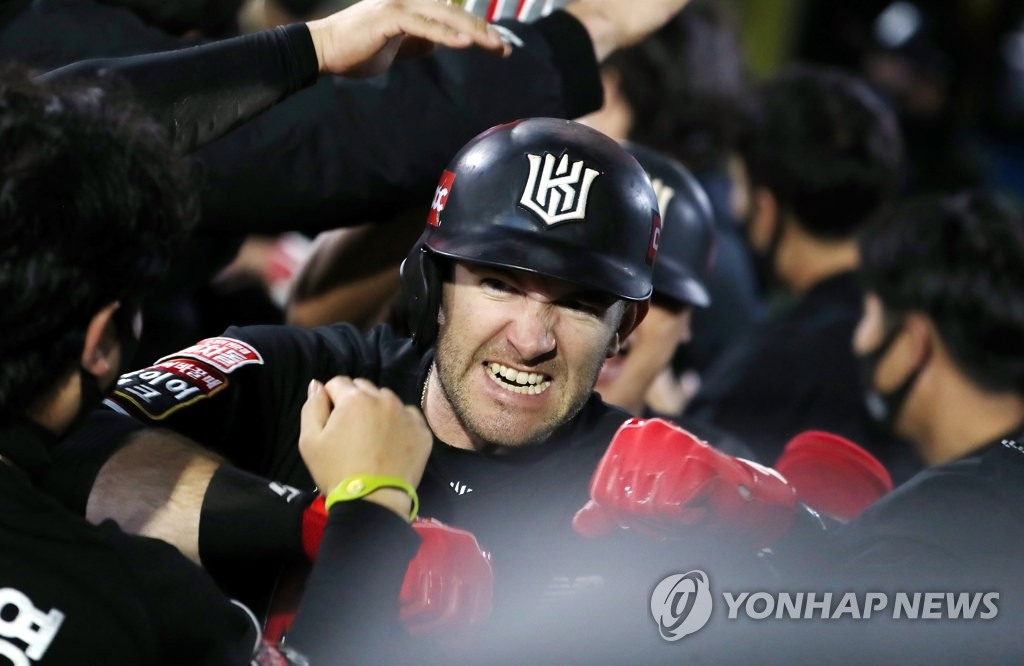 In this file photo from Oct. 30, 2021, Jared Hoying of the KT Wiz is congratulated by teammates after hitting a three-run home run against the SSG Landers in the top of the fifth inning of a Korea Baseball Organization regular season game at Incheon SSG Landers Field in Incheon, some 40 kilometers west of Seoul. (Yonhap)