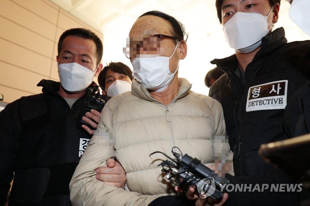 A man, accused of having attacked ruling Democratic Party chief Song Young-gil with a hammer, appears at the Seoul Western District Court in Seoul on March 9, 2022. (Yonhap)