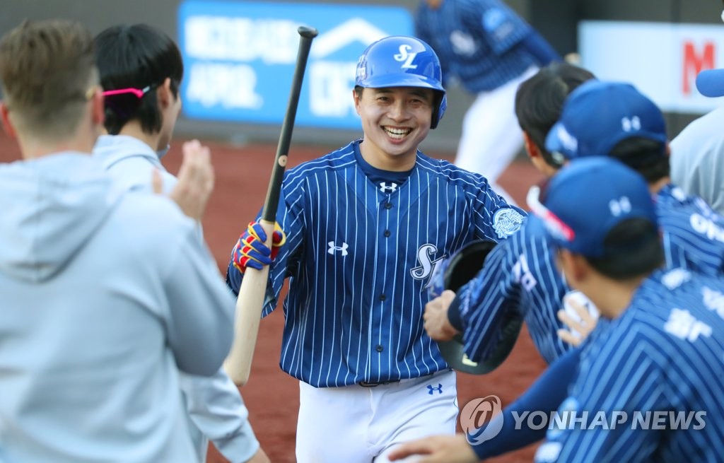 In this file photo from May 15, 2022, Kim Hun-gon of the Samsung Lions is congratulated by teammates after hitting an RBI groundout against the Doosan Bears in the bottom of the eighth inning of a Korea Baseball Organization regular season game at Daegu Samsung Lions Park in Daegu, 290 kilometers southeast of Seoul. (Yonhap)