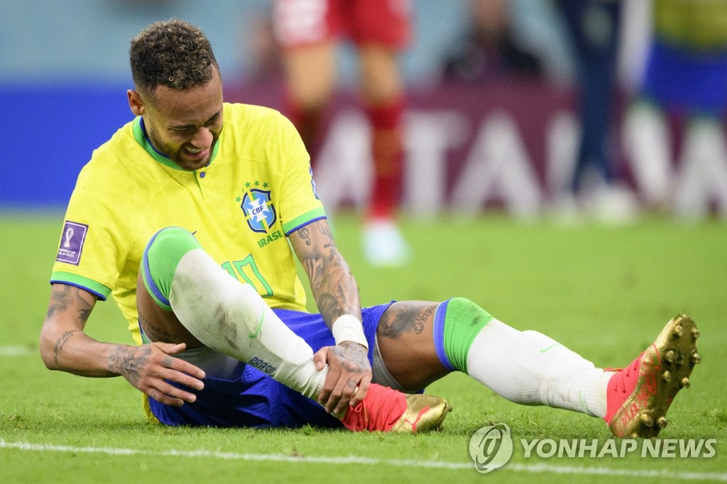 Brazil's Neymar complains of ankle pain during a match against Serbia