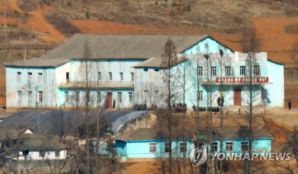 North Korean residents gather at a cultural hall in the North Korean town of Kaepung on the western front-line border with South Korea, in this file photo taken from an observatory in the South Korean border city of Paju on Feb. 15, 2023, a day ahead of the 81st anniversary of the birth of late North Korean leader Kim Jong-il, father of current leader Kim Jong-un. (Yonhap)