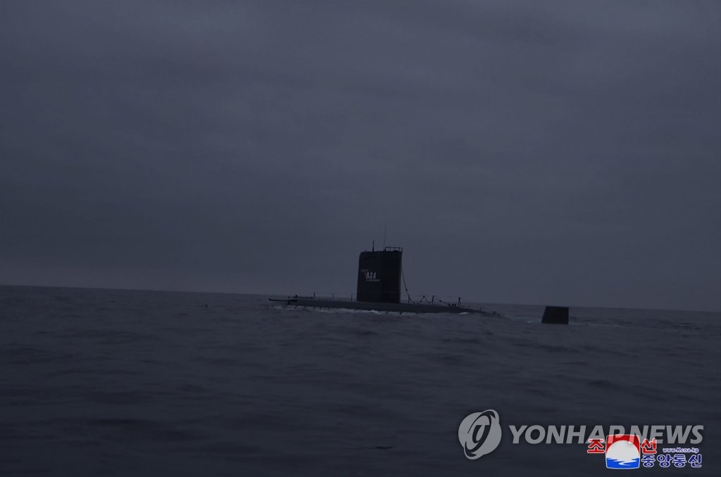 This photo, carried by North Korea's official Korean Central News Agency on March 13, 2023, shows the North's submarine "8.24 Yongung" from which the country fired two "strategic cruise missiles" the previous day. (For Use Only in the Republic of Korea. No Redistribution) (Yonhap)