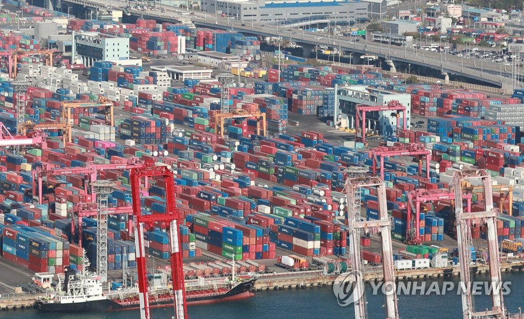 Containers are stacked at a pier in South Korea's largest port city of Busan, 325 kilometers southeast of Seoul, in this file photo taken April 2, 2023. (Yonhap)