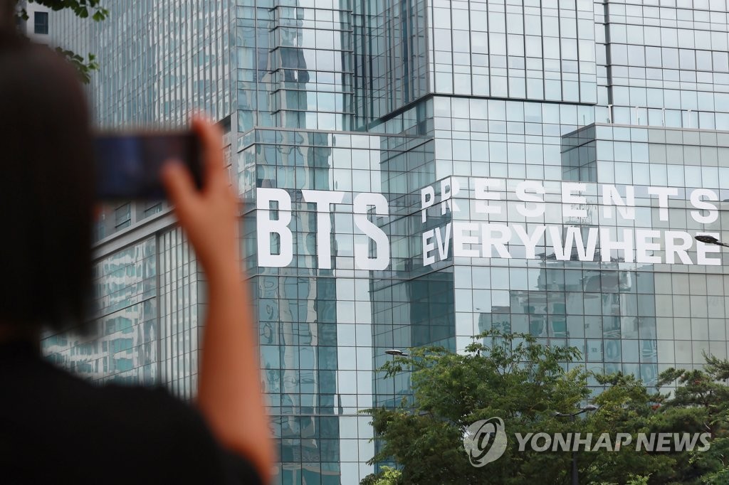 A slogan celebrating the 10th anniversary of K-pop boy group BTS is seen on the exterior of the Hybe building in central Seoul on June 12, 2023. (Yonhap)