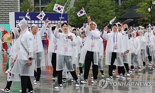 البعثة الكورية الجنوبية في حفل ترحيب في قرية الرياضيين