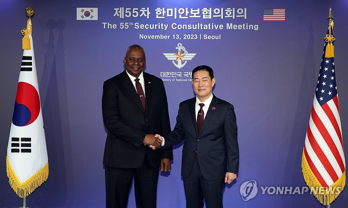 Defense Minister Shin Won-sik (R) and U.S. Secretary of Defense Lloyd Austin shakes hands ahead of the 55th Security Consultative Meeting held at the defense ministry's headquarters in Seoul on Nov. 13, 2023, in this photo provided by the ministry. (PHOTO NOT FOR SALE) (Yonhap)