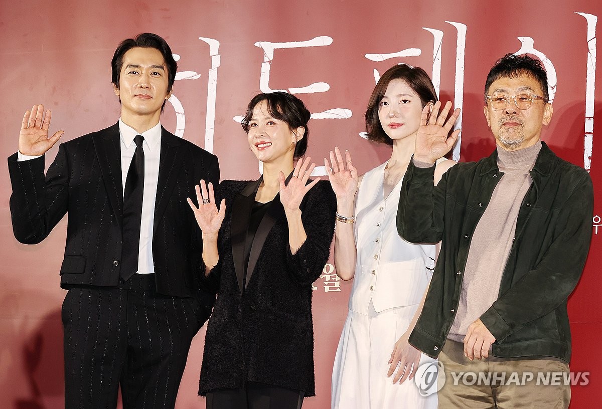 The cast members and director of "The Hidden Face" pose for photos at a press event in Seoul on Oct. 22, 2024. (Yonhap)